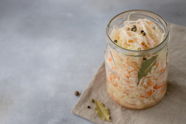 homemade sauerkraut jar side view gray surface - Квашеная капуста без сахара