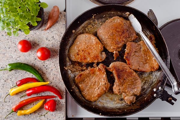 top view roasted pork steak rustic pan - Заговенье