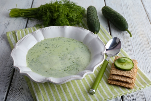 cucumber soup bowl color wooden table background - Постная огуречная похлёбка