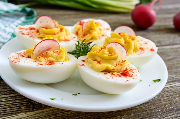 deviled eggs delicious appetizer boiled eggs stuffed with yolk mustard mayonnaise paprika classic recipe - Фаршированные яйца с редисом
