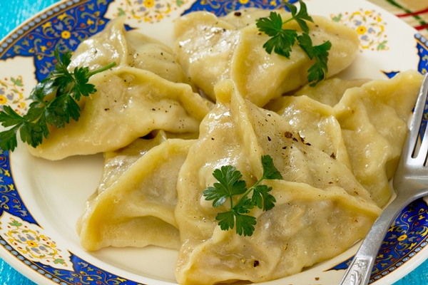 high angle view pasta plate table - Манты с тыквой