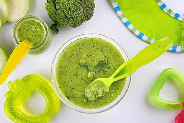 composition with bowl creamy baby vegetable soup white background - Детский супчик с брокколи и кабачком