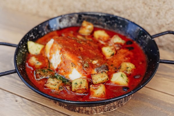 bowl food with red sauce piece fish it - Филе минтая в томатно-оливковом соусе
