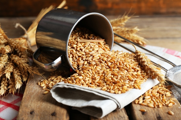 wheat metal cup wooden table closeup - Коливо богатое