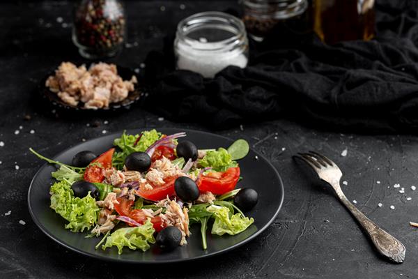 Салат "Нисуаз" high angle salad with different ingredients dark plate - Салат "Нисуаз"